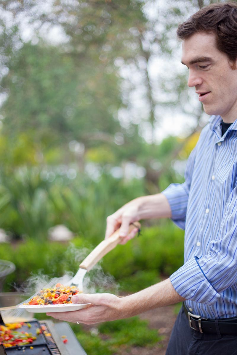 Adam making breakfast burritos