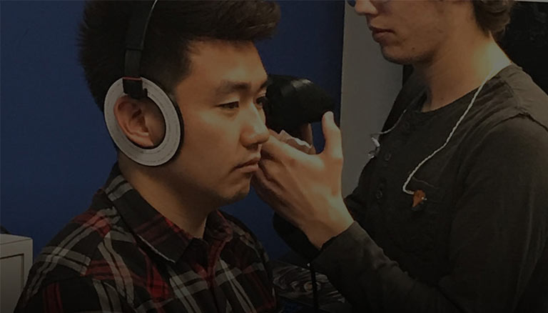 Our employee Ryan having his ears scanned for a pair of Ultimate Ears in-ear monitors